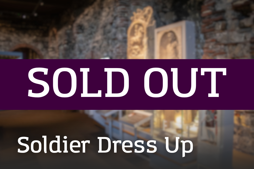 A gallery featuring stone walls and display cases of historic artefacts, overlaid with a “SOLD OUT” banner and the label “Soldier Dress Up.”