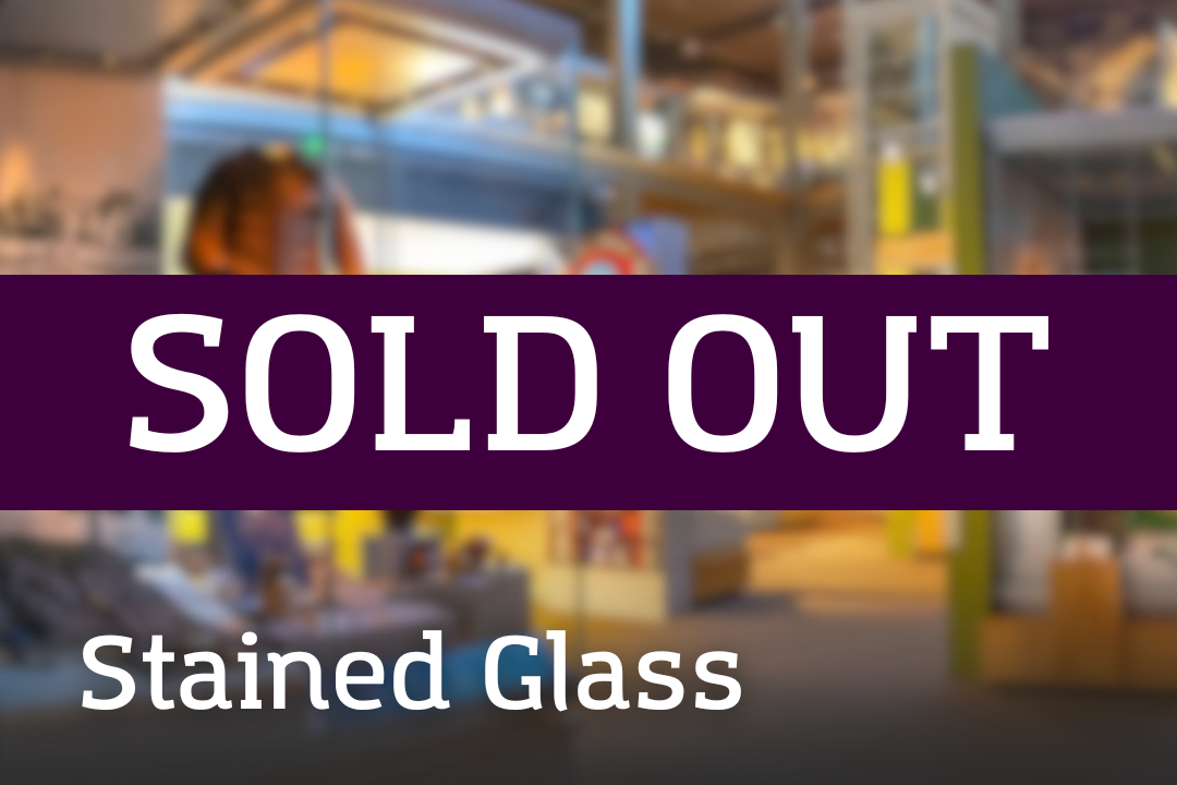 A bright museum space filled with colourful displays and tall structures, overlaid with a “SOLD OUT” banner and the label “Stained Glass.”